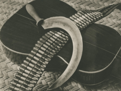 Sickle, Bandolier and guitar ca. 1927