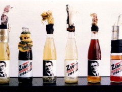 Vincente Razo, Revolucionario institucional, 1994, Molotoc cocktails in six propagandas glass botles and mixed medias, dimensions variables, Courtesy of the artist